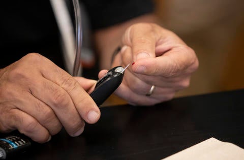 Professor Rich Cardullo drawing blood for an experiment